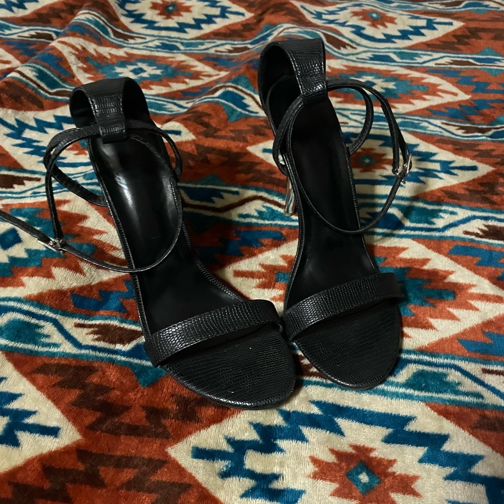 Black strapy heels. Size 9. Worn handful of times. Excellent condition.